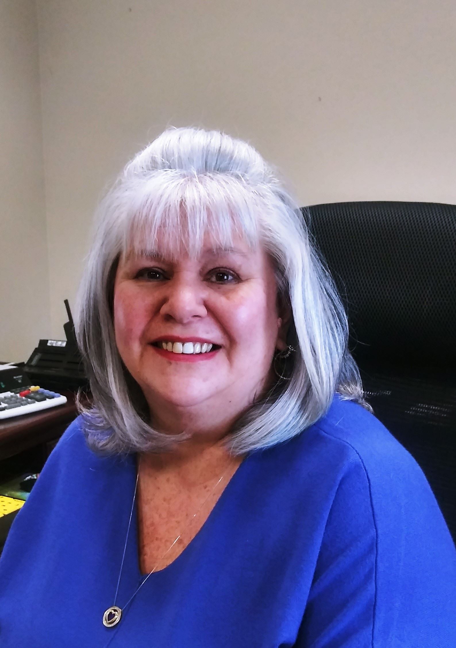 Photo of Leah Watson wearing a blue shirt